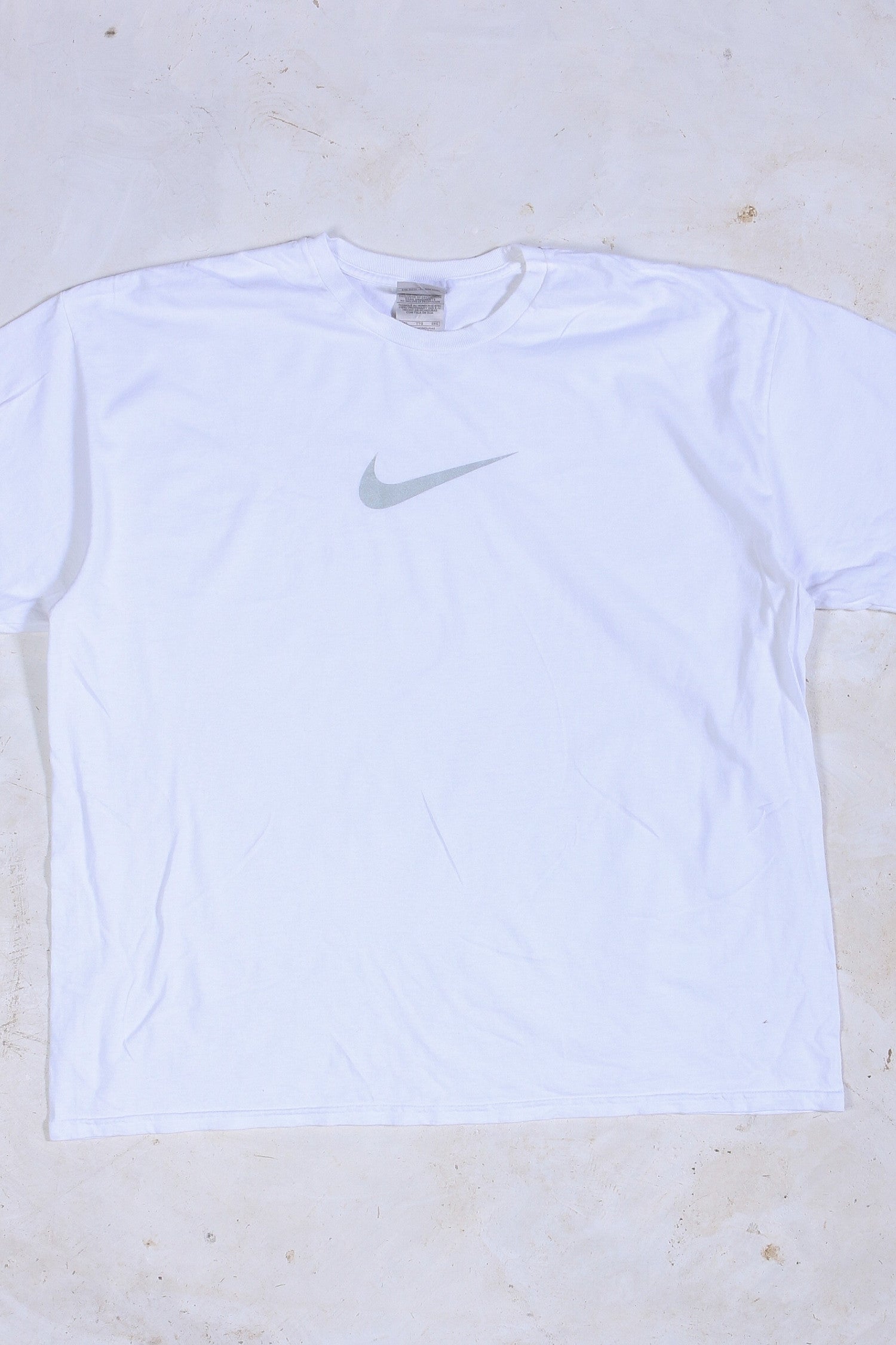 white nike shirt with silver swoosh